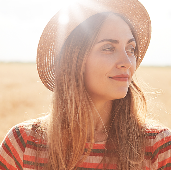 Woman in a hat smiling