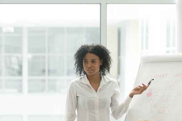 Woman addressing a business meeting