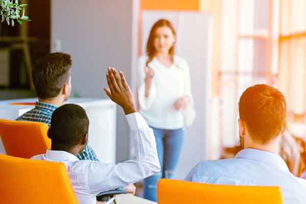 Teacher in front of a group of adult learners