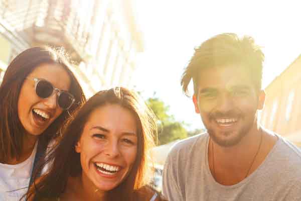 Three friends laughing together