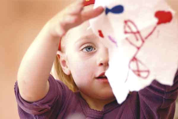 Small girl with a drawing