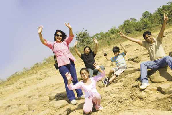 Family waving on a beach