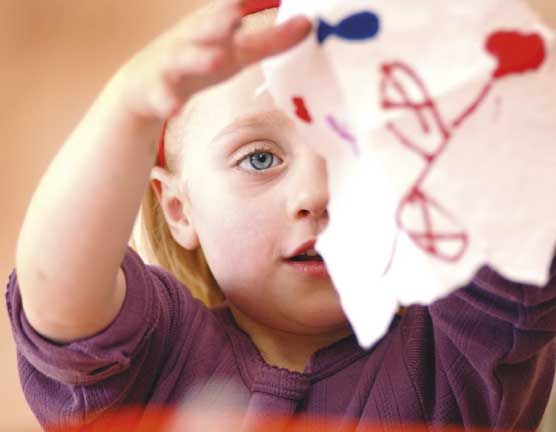 Small girl with a drawing